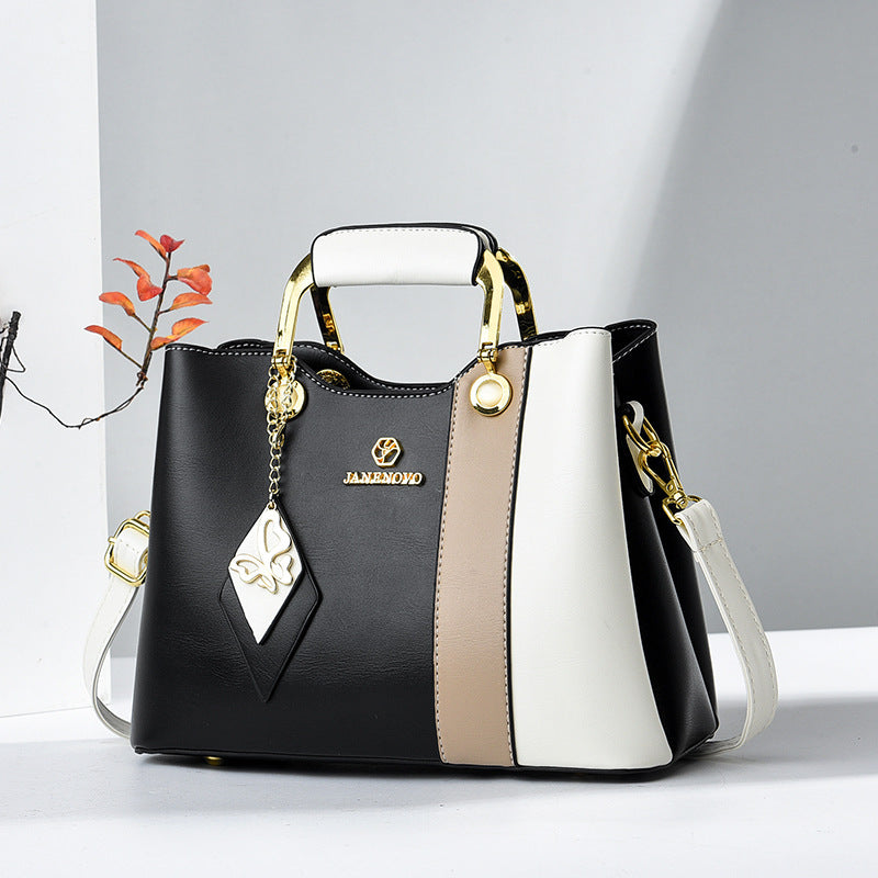Widok z przodu – uchwyt górny, zawieszka motylek i ramiączko crossbody